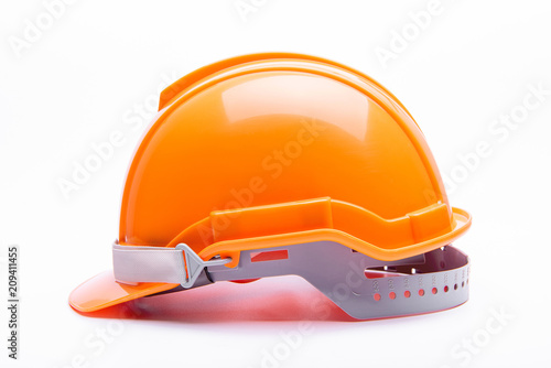 Orange safety helmet construction on white background photo