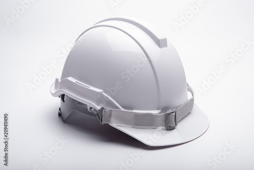Bild auf Leinwand White safety helmet construction on white background.