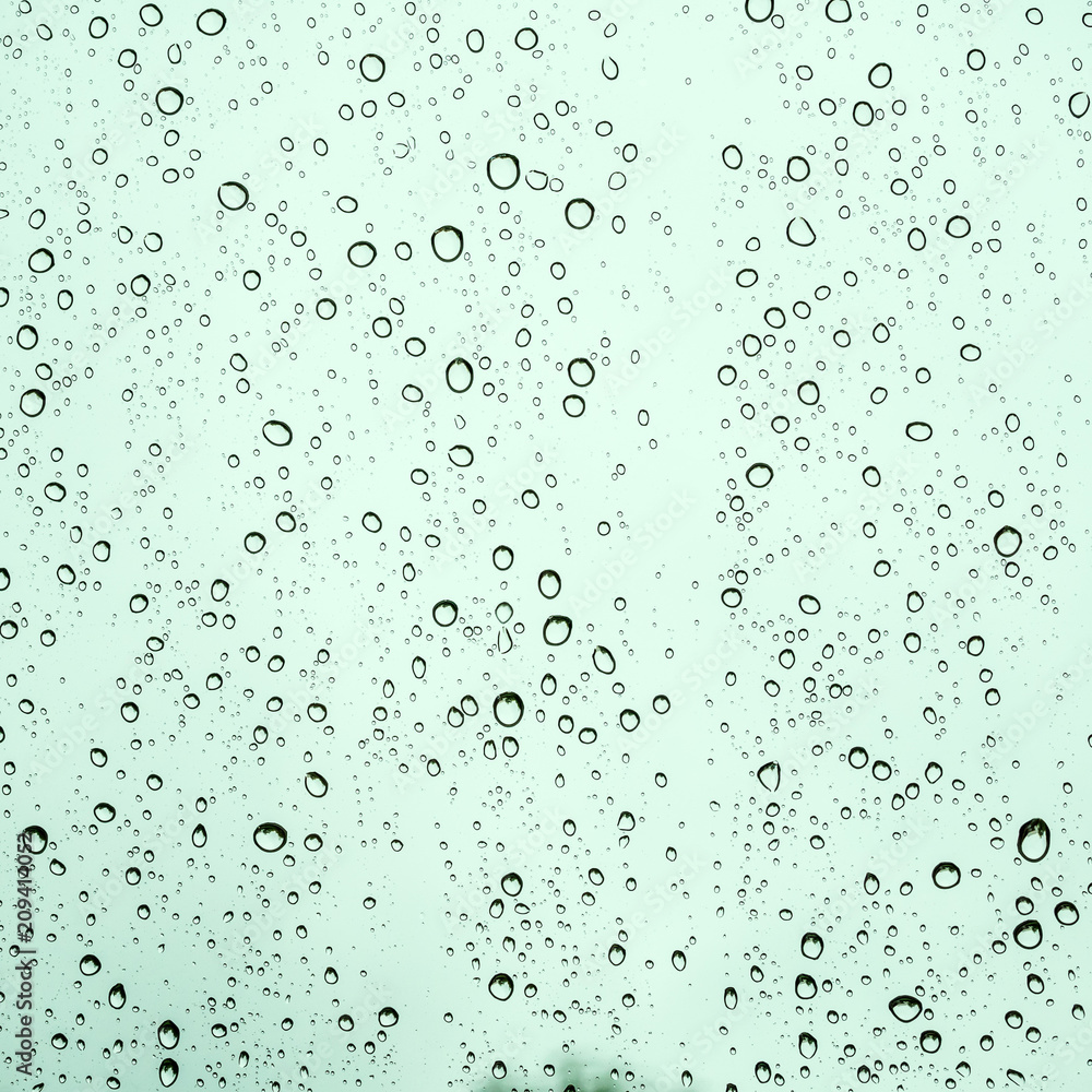 Raindrops on glass car texture.