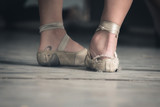 Threadbare ballet shoes of two Cuban dancers illustrates the difficulty all Cubans face with buying their necessities of life