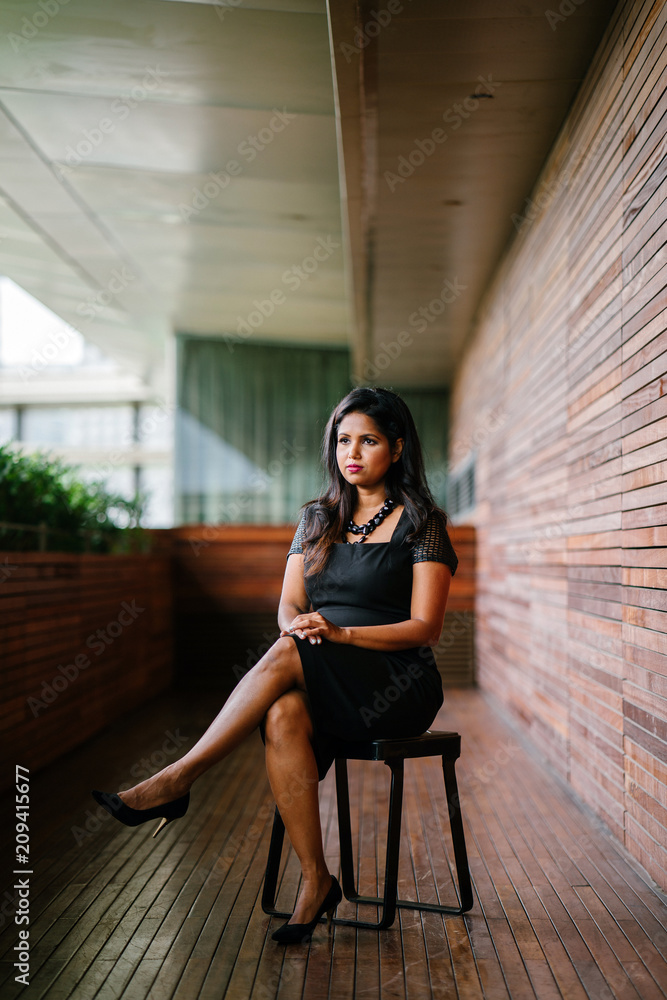 Corporate portrait head shot of a confident and attractive Indian Asian business woman. Corporate portrait head shot of a confident and attractive Indian Asian business woman.