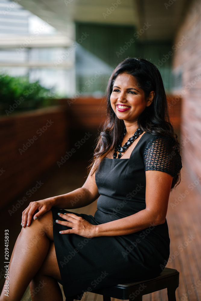 Corporate portrait head shot of a confident and attractive Indian Asian business woman. Corporate portrait head shot of a confident and attractive Indian Asian business woman.