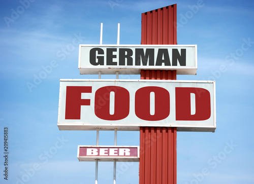 aged german food and beer sign