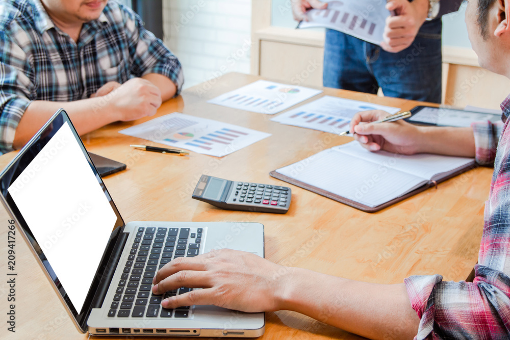 Start up business. people team work meeting point to discuss the graph up and down of economy and work on laptop.Selective Focus Start up business. people team work meeting point to discuss the graph up and down of economy and work on laptop.Selective Focus