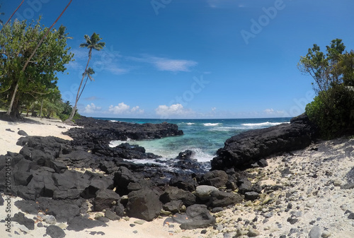 Rocky beach with clear sea water at Lefaga, Matautu, Upolu Island, Samoa, South Pacific photo