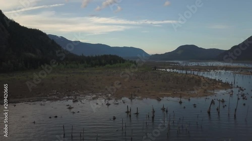 Aerial drone landscape view of the beautiful Canadian Nature during a vibrant morning. Taken in Stave Lake, East of Vancouver, BC, Canada. photo