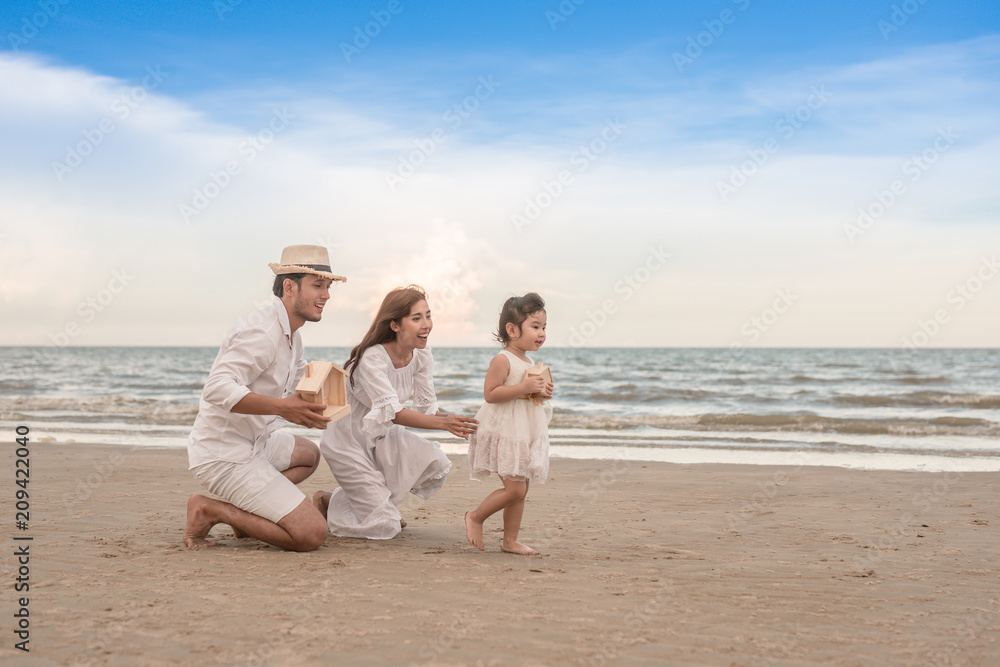 parent's hands and daughter holding private property in sea beach parent's hands and daughter holding private property in sea beach