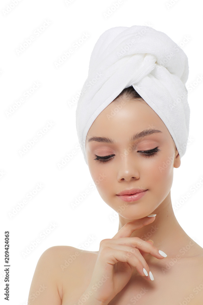 Beautiful woman in a white towel on a head. Beautiful woman in a white towel on a head.
