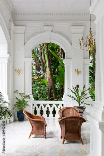 Old historic courtyard with green palms in Singapore