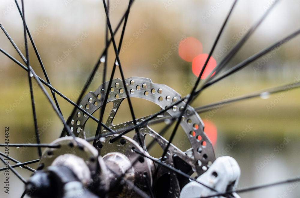 Front Hub of a Mountain Bike Close-Up. Bicycle Disc Brake Rotor Front Hub of a Mountain Bike Close-Up. Bicycle Disc Brake Rotor