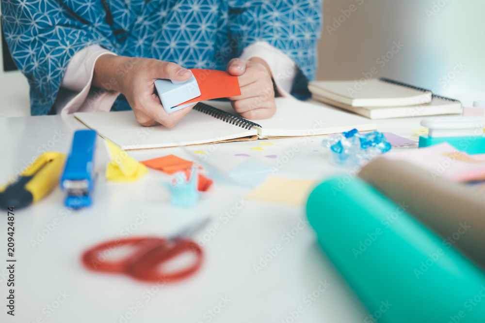 Handmade, the girl cuts out of paper. Handmade, the girl cuts out of paper.