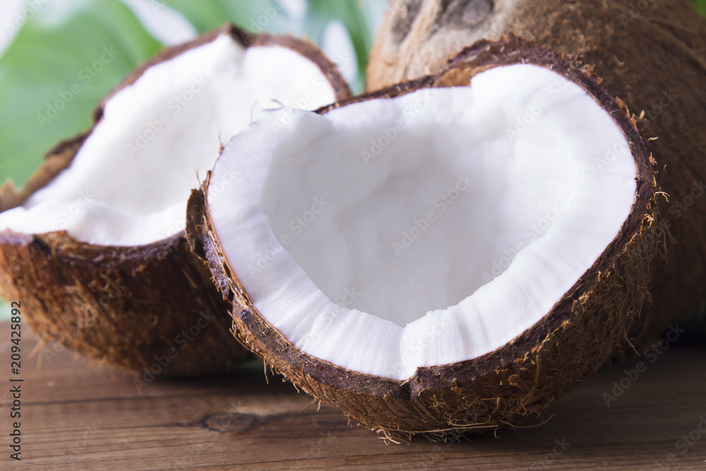 coconut on wooden table coconut on wooden table