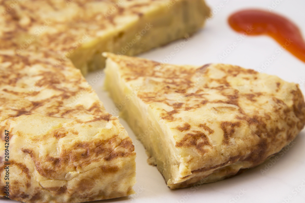 spanish potato omelette dish and tomato sauce spanish potato omelette dish and tomato sauce