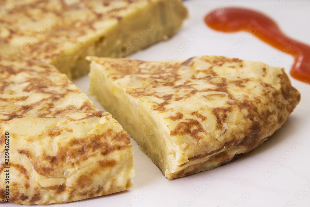 spanish potato omelette dish and tomato sauce spanish potato omelette dish and tomato sauce