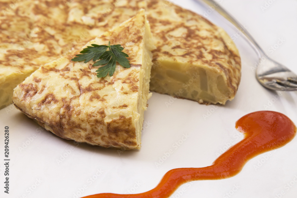 traditional spanish omelette dish with tomato sauce traditional spanish omelette dish with tomato sauce
