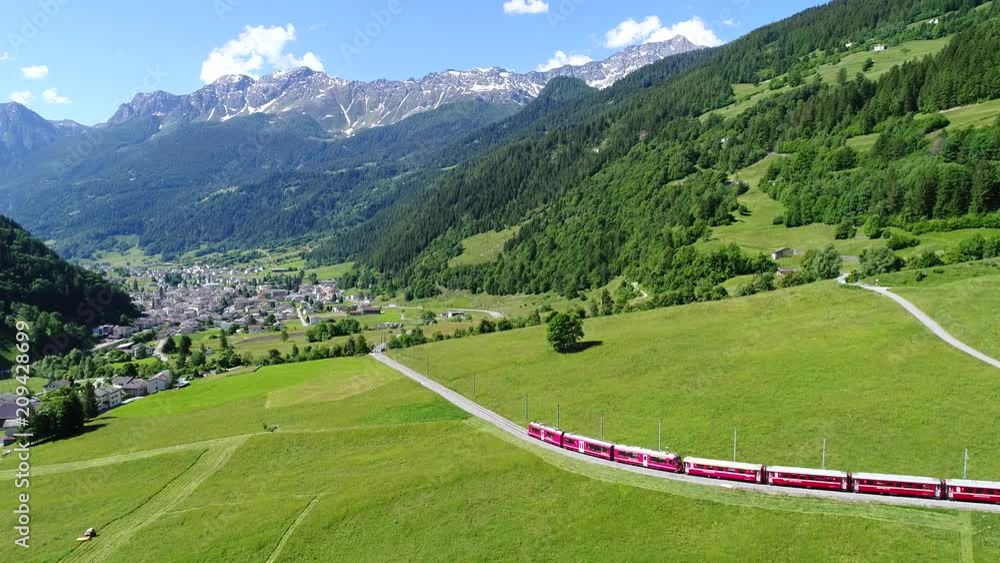 Red train of Bernina in Val Poschiavo, aerial view