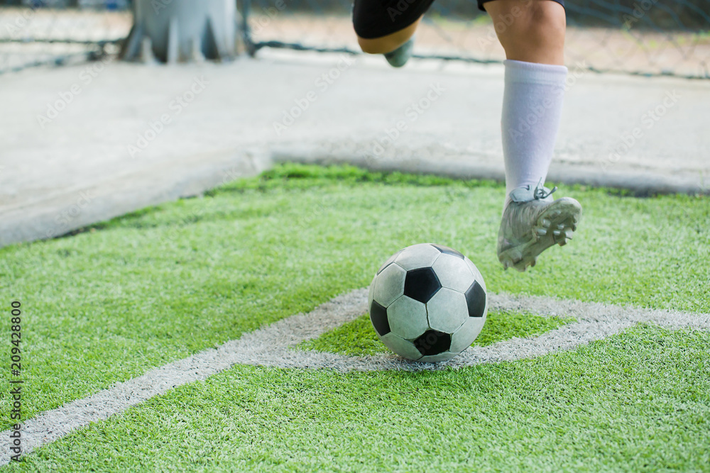 Fototapeta premium The soccer player shoot ball at corner