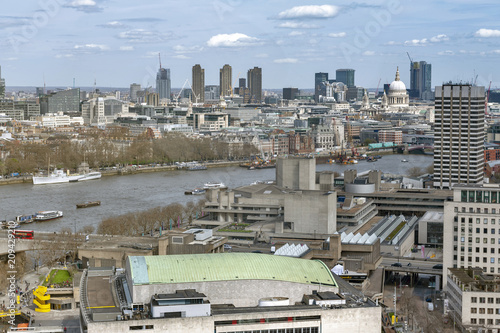 Aerial view of cityscape and skyline of London with the Thames, a major river that flows through southern England, most notably through London, United Kingdom