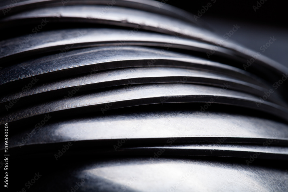 Lot of metal cutlery on a black background. Selective focus. Shallow depth of field