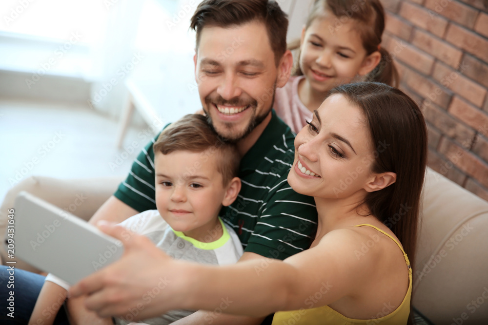 Young woman taking selfie with her family at home Young woman taking selfie with her family at home