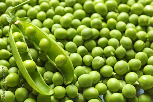 Many fresh green peas as background, closeup