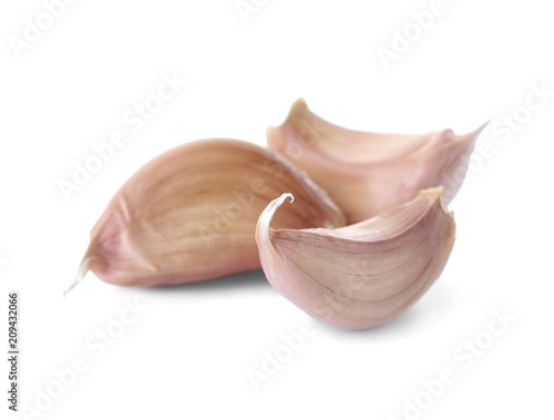 Ripe garlic cloves on white background. Organic product