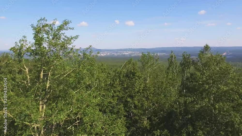 Zlatoust city - Large industrial city in the Ural mountains, Chelyabinskaya oblast, Russia. Aerial view at summer sunny day Zlatoust city - Large industrial city in the Ural mountains, Chelyabinskaya oblast, Russia. Aerial view at summer sunny day
