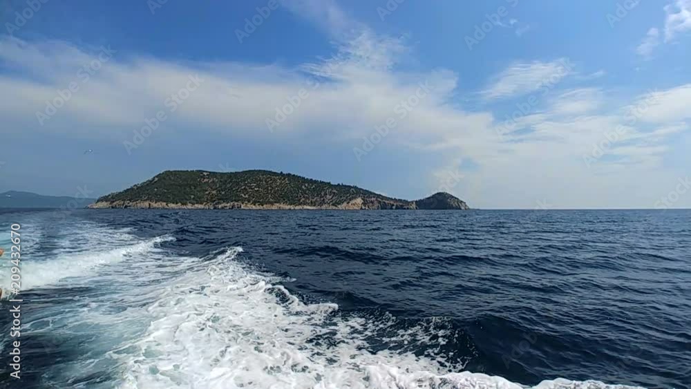 The motion in the sea on the island background. slow motion