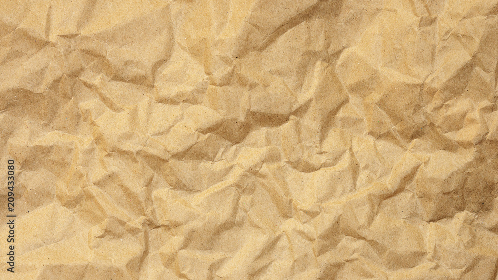 Obraz premium Brown creased paper for a background texture.