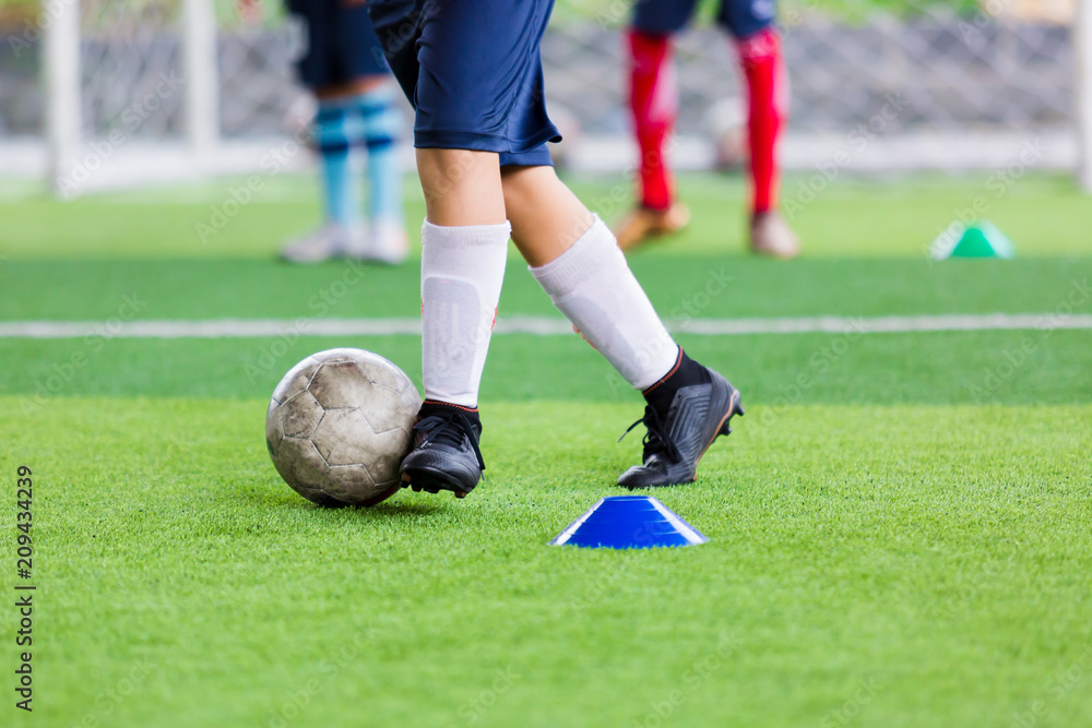 Obraz premium Kid soccer trap and control the soccer ball
