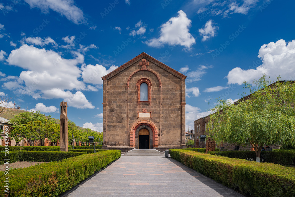 Central portal of the Church of St. Mesrop Mashtots in Oshakan village. Summer sunny day in Armenia.