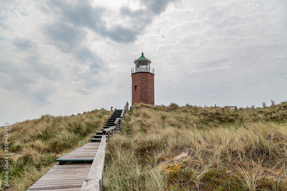 Stepped road to Kampen Lighthouse with the typical heathland plants at Sylt / Germany Stepped road to Kampen Lighthouse with the typical heathland plants at Sylt / Germany