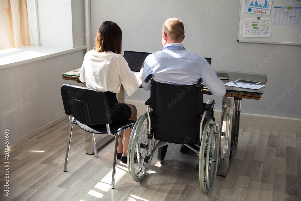 Disabled Businessman Working On Laptop Disabled Businessman Working On Laptop