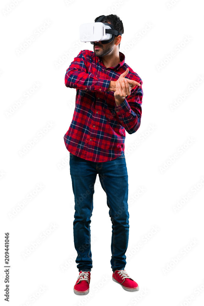 Handsome man using VR glasses. Virtual reality experience Handsome man using VR glasses. Virtual reality experience
