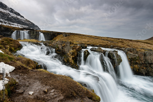 Amazing Icelandic landscape at the top of Kirkjufellsfoss waterfall with Kirkjufell mountain in the background on the north coast of Iceland Snaefellsnes peninsula