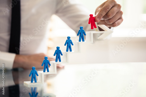 Businessperson Picking Red Human Figure