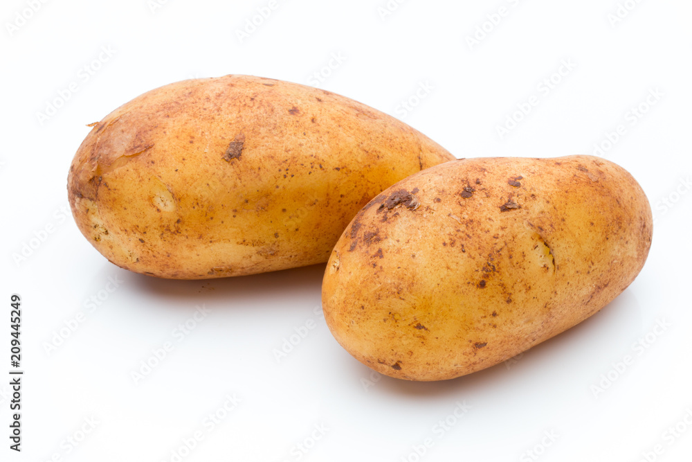 A bio russet potato isolated white background. A bio russet potato isolated white background.