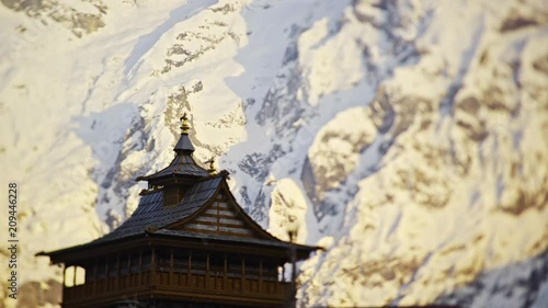 Wallpaper Mural indian village in mountain at spring time,close-up scenic view dark silhouette temple at background bright snow mountain in sun light Torontodigital.ca