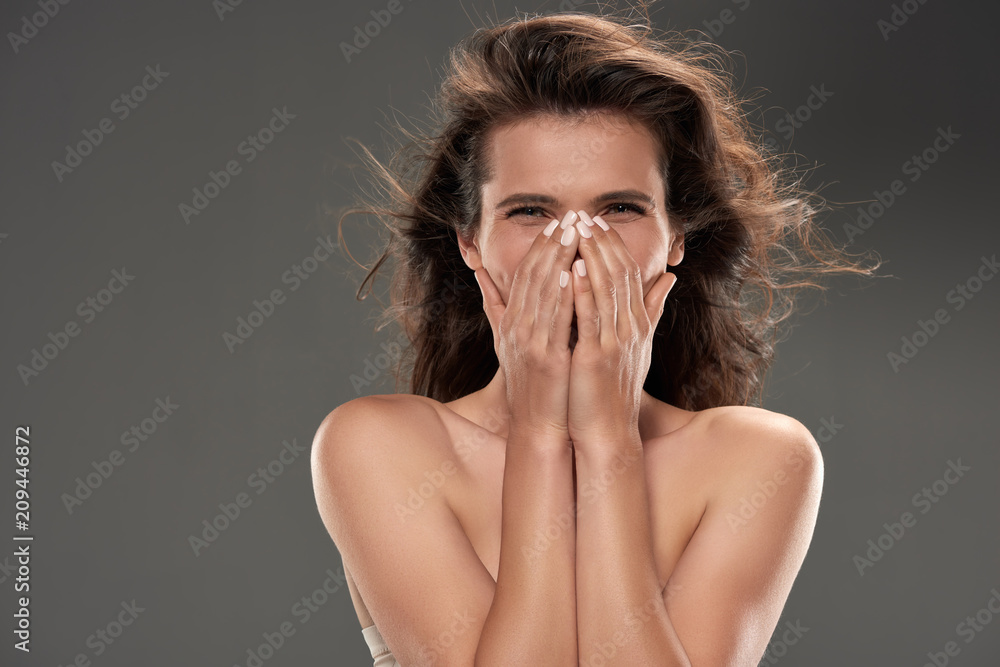 beautiful naked laughing woman, isolated on grey beautiful naked laughing woman, isolated on grey