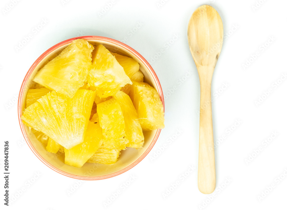 Pineapple in bowl on white background. Pineapple in bowl on white background.