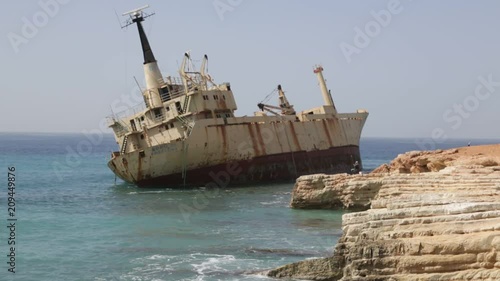 in cyprus the abandonated boat near the coastline photo