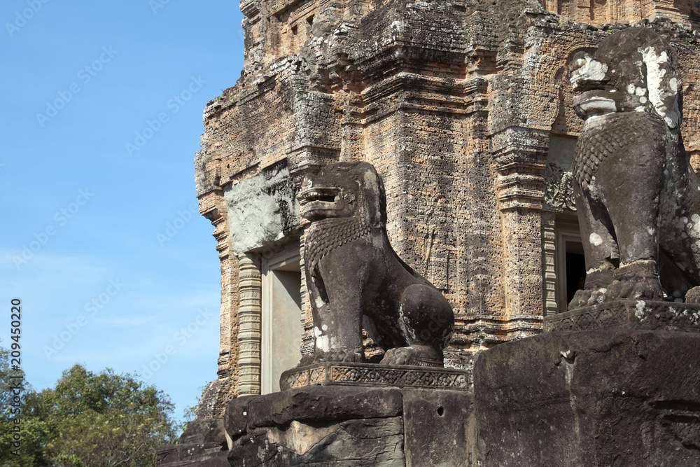 Siem Reap Cambodia, lion statues protecting the ruins of 10th Century East Mebon temple 