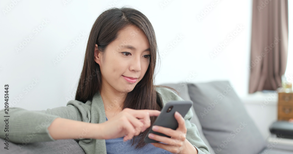 Young woman use of smart phone at home Young woman use of smart phone at home