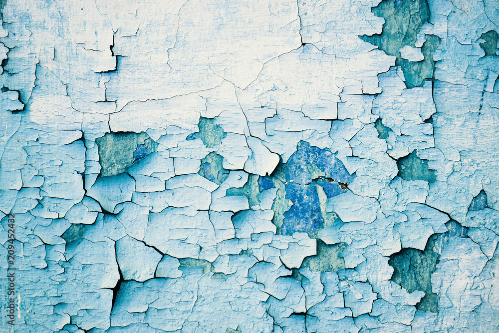 Obraz premium Grunge blue wall with peeling paint, close-up