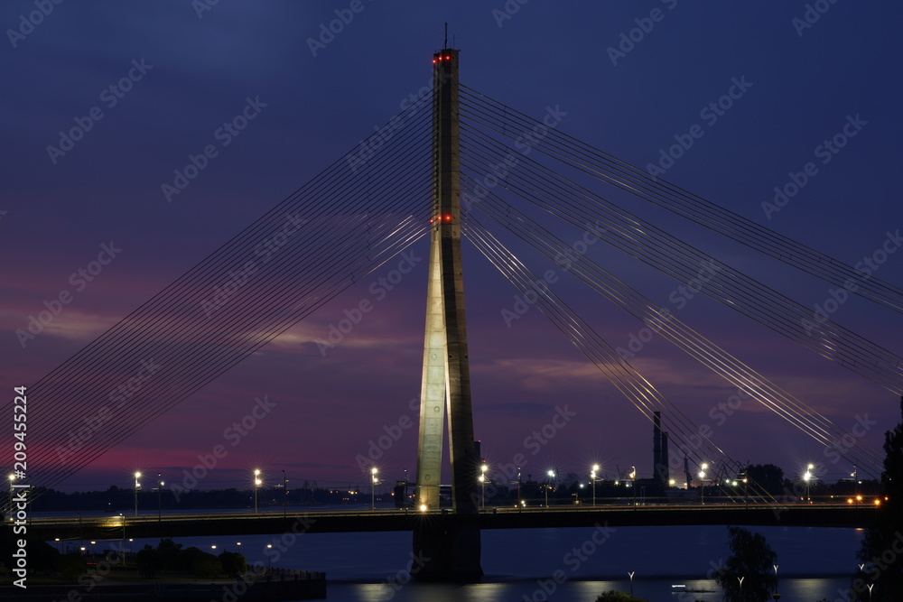 Fototapeta premium View at the Vanšu Bridge and the Daugava river in Riga, Latvia at night