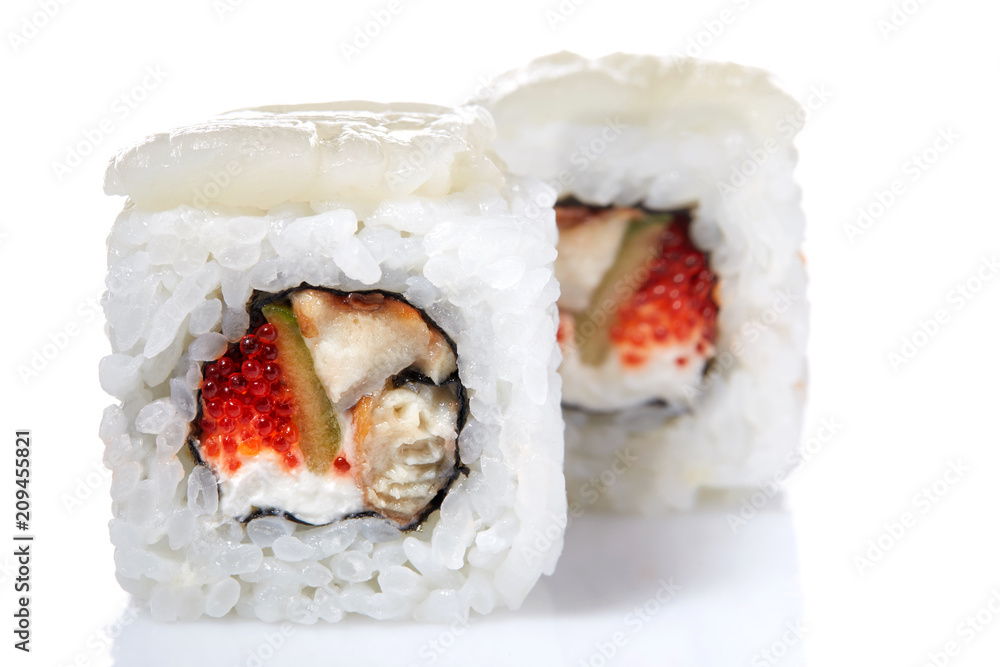 Traditional fresh japanese sushi rolls on a white background, close-up, selective focus. Traditional fresh japanese sushi rolls on a white background, close-up, selective focus.