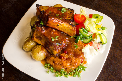 Dish with pork ribs and vegetables