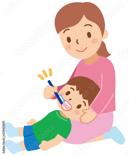 子供に仕上げの歯磨きをする母親