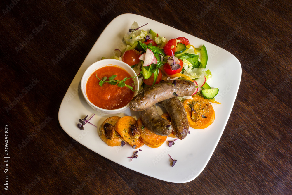 Fried sausages and salad