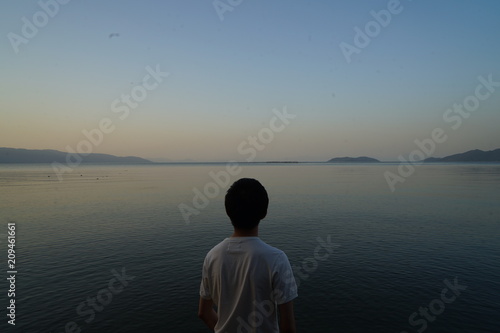 A man stand by lake side © yuyata23